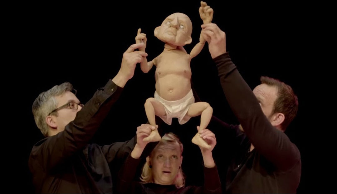 Three puppeteers demonstrating puppetry