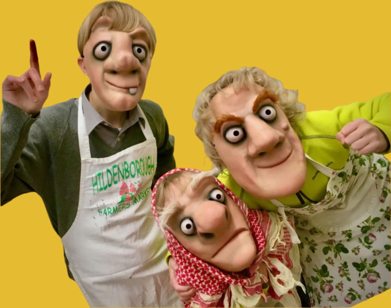 Three masked characters with exaggerated features against a yellow background