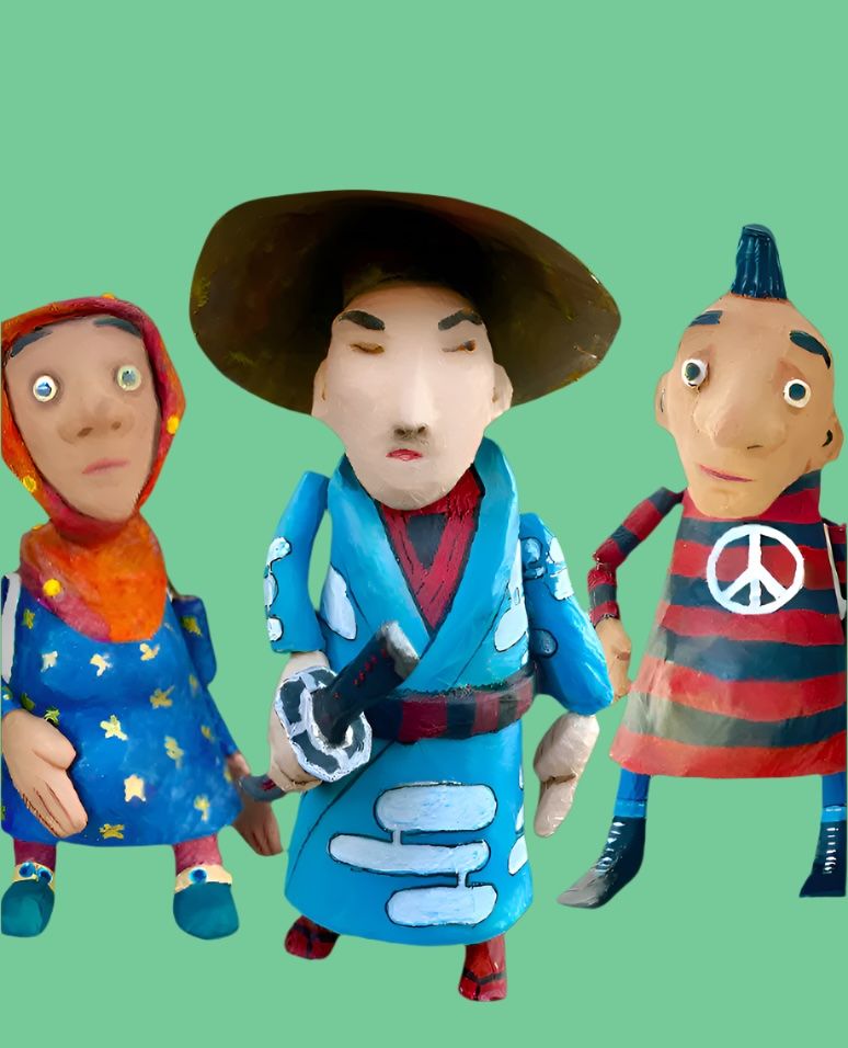 Three colorful figurines with distinct outfits on a green background