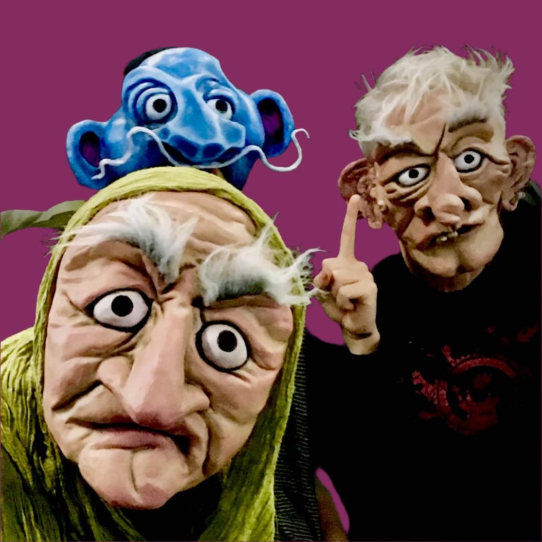 Three masked characters with exaggerated features against a purple background